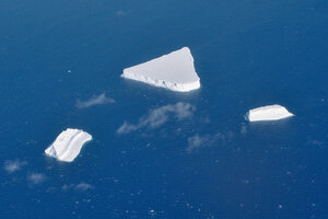 Ice bergs, calved off some undetermined ice shelf or glacier