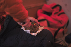 Eating some New Zealand Christmas cake as a break from digging holes.